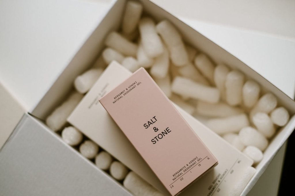 A close-up of Salt & Stone natural deodorant boxes in eco-friendly packaging, perfect for cosmetics advertisement.